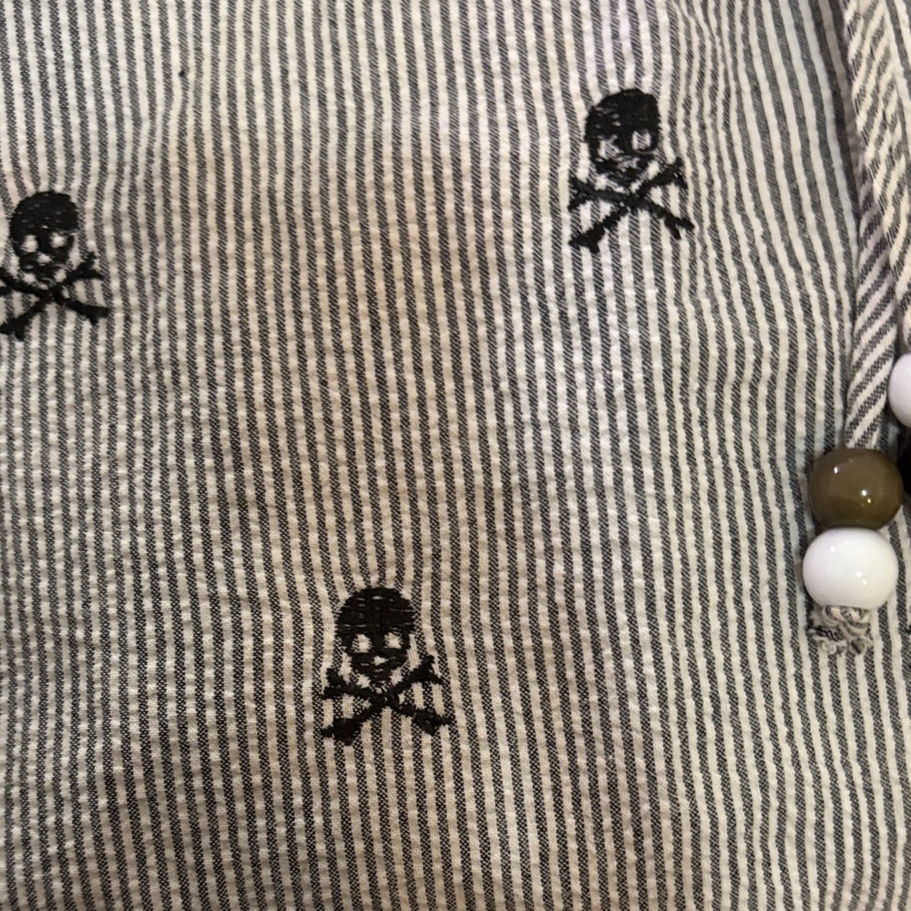 Sleeveless Pinstripe dress with dark blue skull embroidery detail